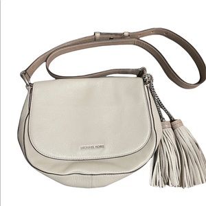 Leather cream shoulder bag with decorative tassels